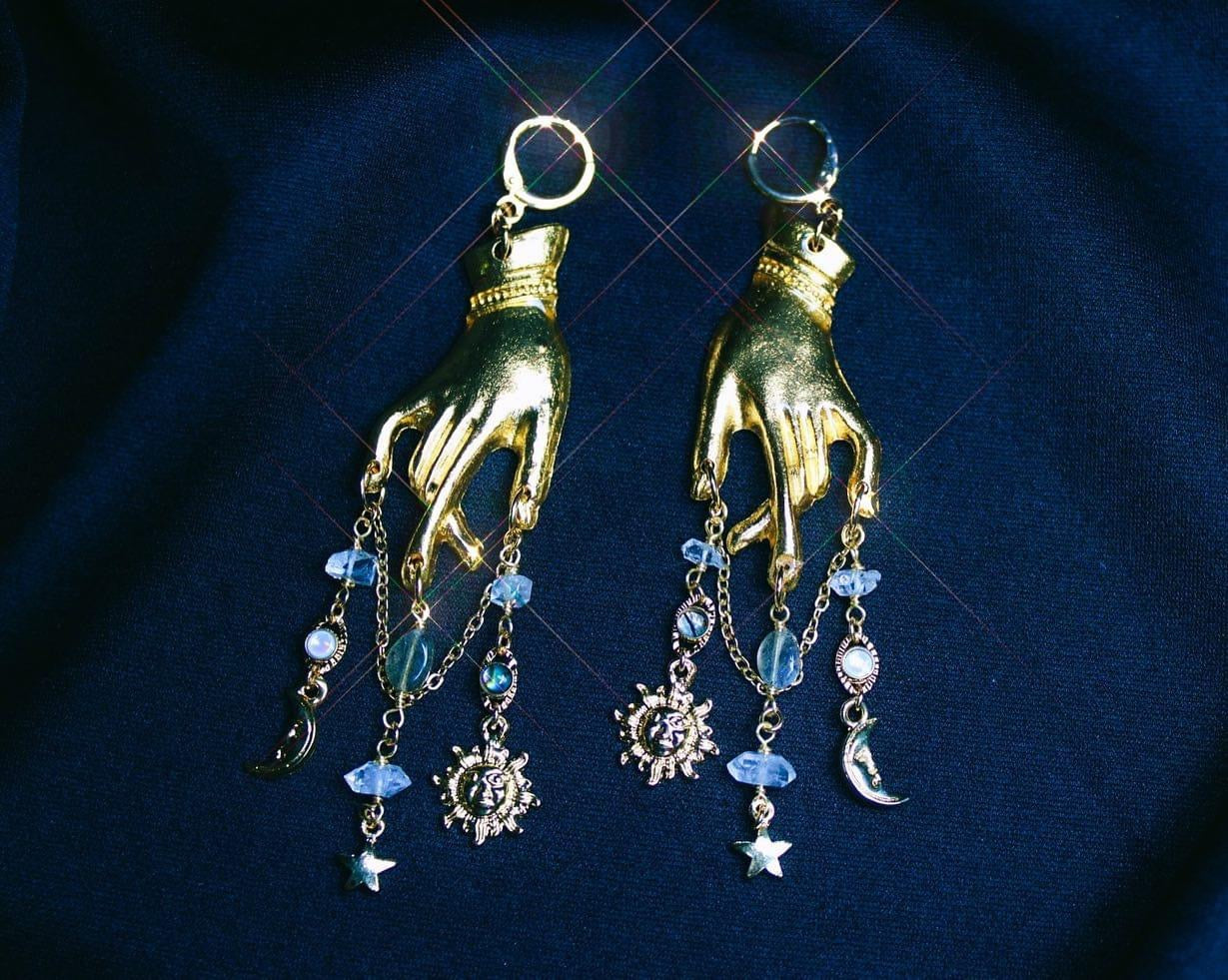 Aretes Manos astrales